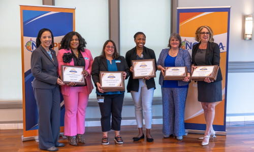 Members of CMS Communications hold Blue Ribbon awards